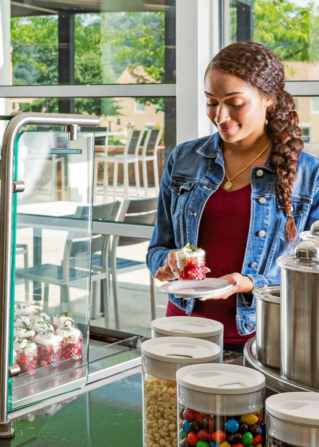 Student grabbing dessert from serving line